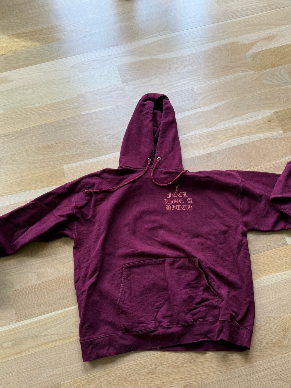 Woman’s Burgundy Hooded Sweatshirt - Graphic Front